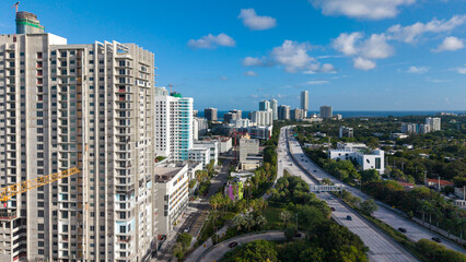 Fototapeta premium Aerial view of downtown Miami skyline with highway interchange and skyscrapers