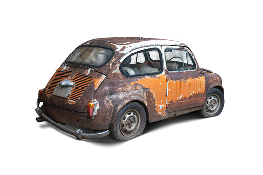 An isolated shot of a heavily weathered and rusty vintage classic car with peeling orange and white paint, flat tires, and corrosion, isolated on a pure white background for easy cutout design.