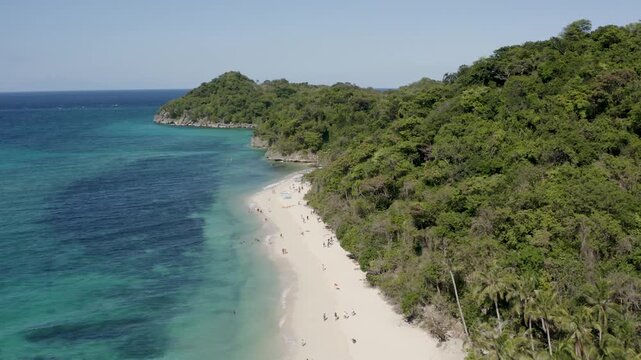 Aerial View of Tourists on Puka Shell Beach with Lush Green Hills Bora