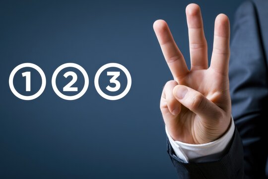 A businessman hand displays three raised fingers near numbered icons. Concept for business countdown or strategy.