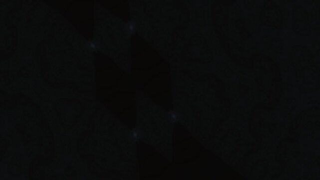 Abstract dark background with flickering glowing geometric diamond shapes