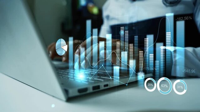 Businessman using a laptop with glowing holographic finance charts and graphs animation on screen, Business data analysis growth investment and digital technology in a modern office