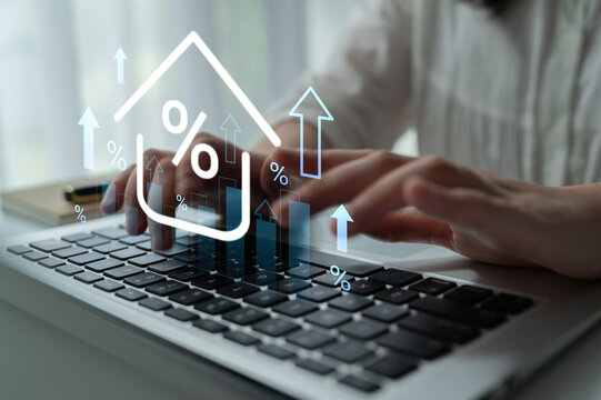 A close-up view of hands typing on a laptop, complimented by digital graphics representing growth and financial metrics, showcasing modern business analysis. Gantry