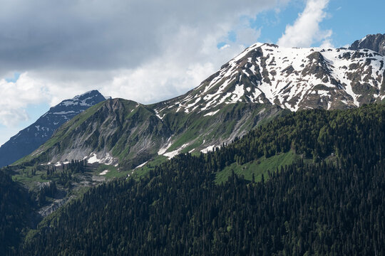 Tranquil Cloudscape Drifting Over Rugged Mountains