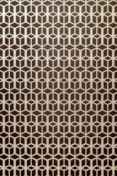 A repeating geometric pattern of white cubes and hexagons creating a three-dimensional optical illusion on a dark brown background, ideal for modern architectural textures and design backgrounds.