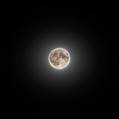 Bright moon shines over La Rochelle at night, casting light over the dark sky and revealing its details © Florent Vassogne