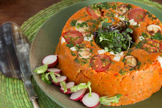 Traditional Brazilian cuscuz paulista savory cornmeal cake.