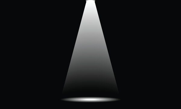 Spotlight beam illuminating a dark stage with a bright cone of light and subtle shadow for conceptual use