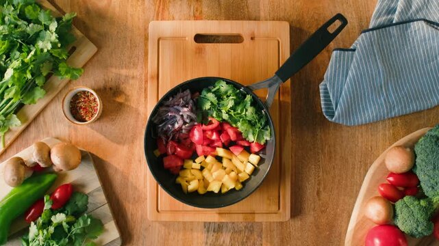 Salad mix, yellow sweet pepper, tomato, cilantro, parsley, Healthy food, Chef hands with knife for onion, cutting and preparation with cooking for dish. Restaurant stew. 