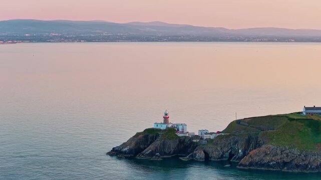 aerial 4k footage of Howth Head Lighthouse during sunset, Dublin Ireland