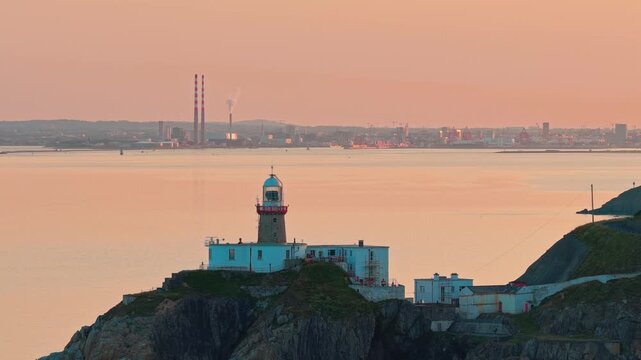aerial 4k footage of Howth Head Lighthouse during sunset, Dublin Ireland
