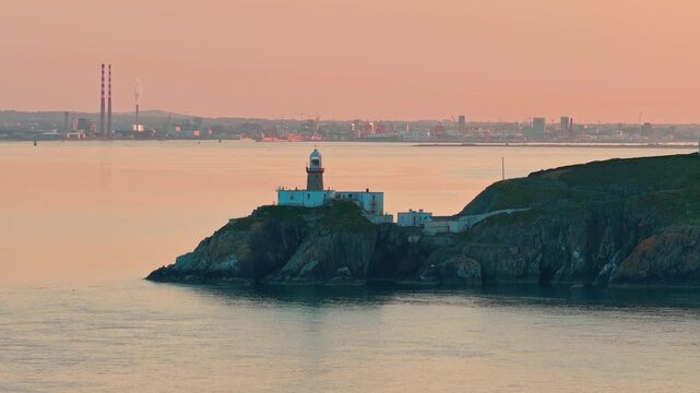 aerial 4k footage of Howth Head Lighthouse during sunset, Dublin Ireland