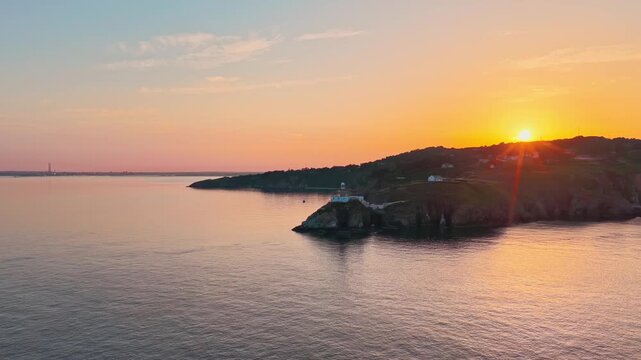 aerial 4k footage of Howth Head Lighthouse during sunset, Dublin Ireland