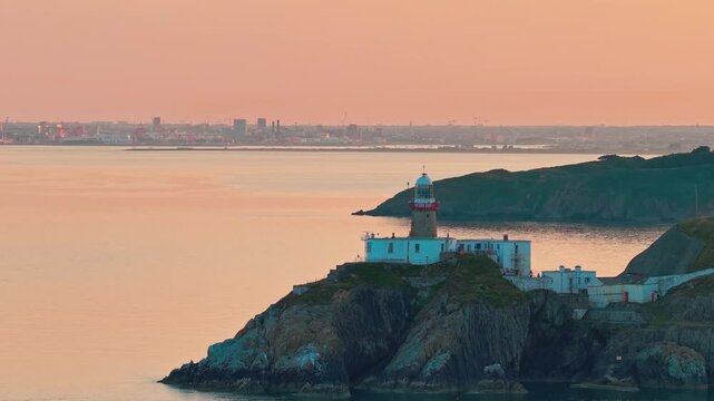 aerial 4k footage of Howth Head Lighthouse during sunset, Dublin Ireland