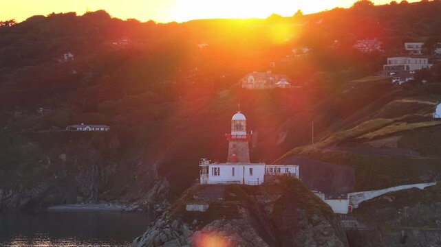 aerial 4k footage of Howth Head Lighthouse during sunset, Dublin Ireland