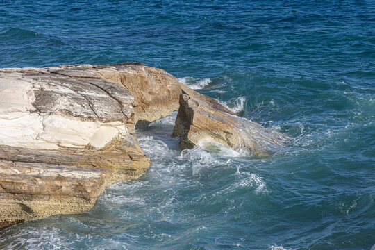 Waves Crashing Against White Limestone Cliffs on a Rocky Mediterranean Coastline