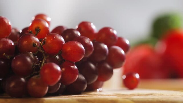 Red grape, spanish supermarket food, Close-up green grape cluster on vine in the vineyard. Stock Photo