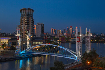 Fototapeta premium An illuminated bridge over Manchester Ship Canal during blue hour