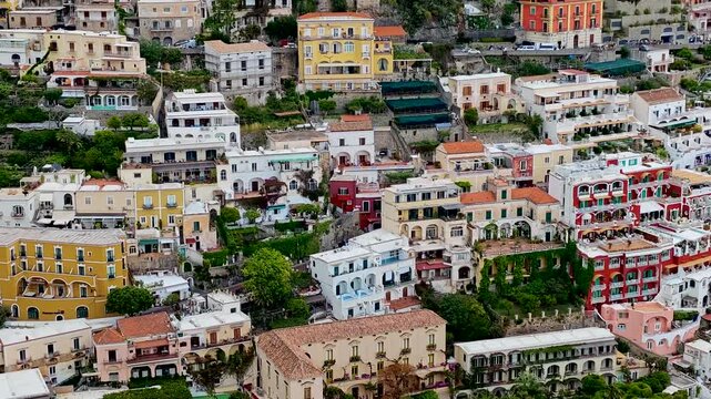 Positano, Italy. Stunning aerial drone 4K video footage with panorama of Positano town on the Amalfi Coast, colorful hillside houses, dramatic cliffs and the Mediterranean Sea