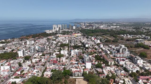 Aerial drone pull-back revealing Versalles neighborhood in Puerto Vallarta Mexico