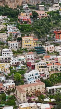 Positano, Italy. Stunning aerial drone 4K video footage with panorama of Positano town on the Amalfi Coast, colorful hillside houses, dramatic cliffs and the Mediterranean Sea