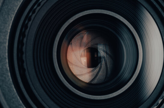 Close-up of camera lens aperture blades and optical elements,Macro,Detailed macro shot of a professional camera lens showing the mechanical aperture blades, iris diaphragm, and precision glass element