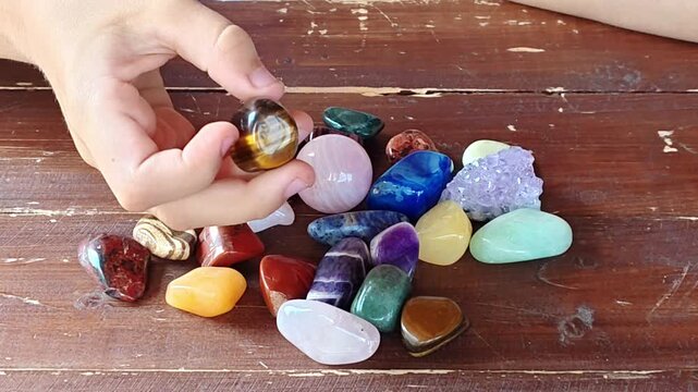 Natural minerals in hand. Semi-precious multi-colored stones, minerals close-up. Mineralogy. Collection of minerals.