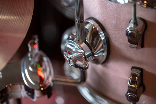 Drum kit hardware with pink metallic drum shell