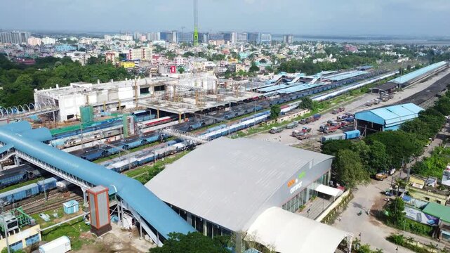 Drone Shot of Cuttack Junction Railway Station in Odisha with Trains and Tracks. Modern Indian Railway Station, Passenger Trains, and Urban Landscape. Busy Railway Station in Middle of Indian City. 