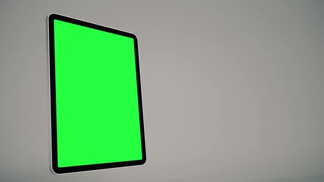Rotating Tablet With Green Screen Flying In and Out