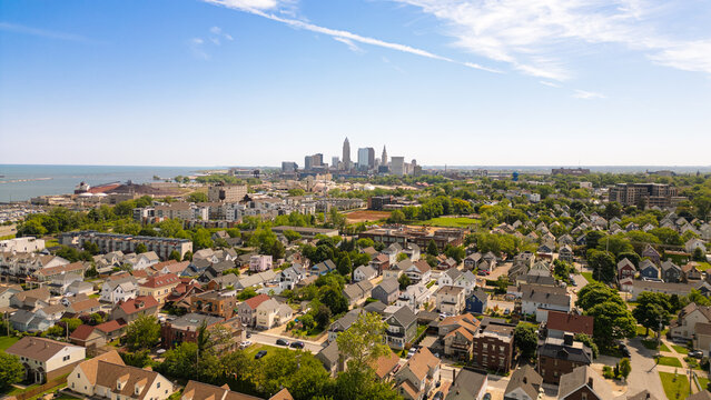 Dense neighborhood with city skyline in the distance