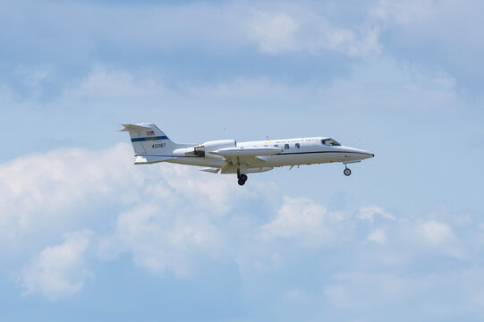 Prague, Czech Republic - July 22, 2026: United States Air Force C-21A Learjet 84-0087 descends on final approach with landing gear extended.
