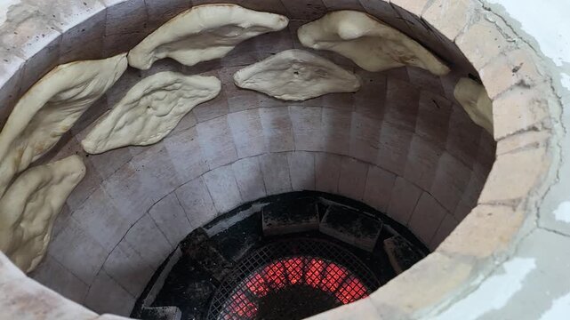 Flatbread dough shoti, lavash baked on the hot clay walls of a traditional georgian tone oven.