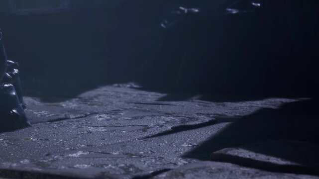 A stone path is visible in low light with shadows cast by nearby objects. The setting looks old and worn with a sense of mystery around it. There are hints of fog in the atmosphere.