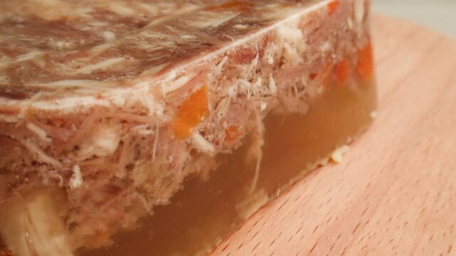 Meat aspic, slavic food, Traditional Russian pork meat aspic Kholodets with horseradish, mustard, jellied jelly beef, eating in restaurant chicken tasty dish. Close up on kitchen. 