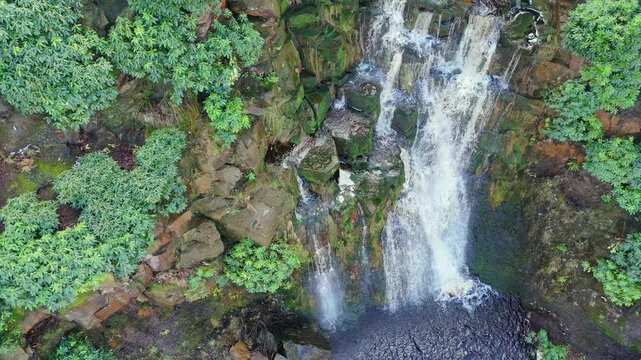 Aerial drone footage of a tall rocky waterfall in the Yorkshire Dales, Pennies. Moorland scene of a majestic waterfalls near Marsden West Yorkshire. Huddersfield Outdoors