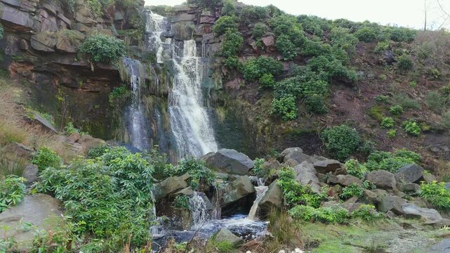 Aerial drone footage of a tall rocky waterfall in the Yorkshire Dales, Pennies. Moorland scene of a majestic waterfalls near Marsden West Yorkshire. Huddersfield Outdoors