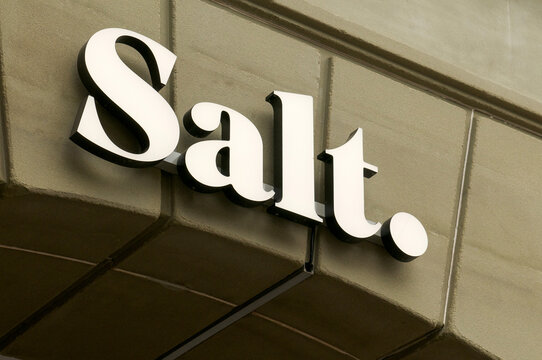 Salt Mobile telecommunications company logo sign on stone facade in Bern