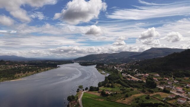 Rio mi&ntilde;o river emptying into the atlantic ocean, forming an estuary separating spain and portugal