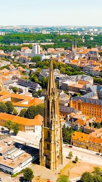 Vertical video. Metz, France. Temple de La Garrison de Metz. View of the historical city center. Summer, Sunny day. Drone footage, Point of interest. Rich colors