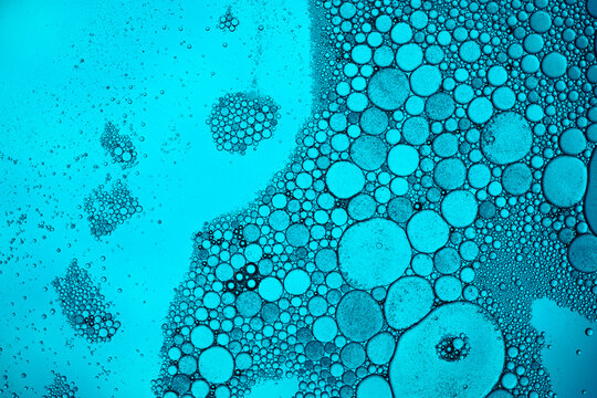 Abstract blue oil and water bubbles macro pattern