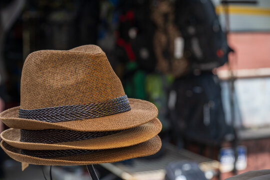 Stacked brown fedora straw hats at dongmyo flea market in seoul south korea.