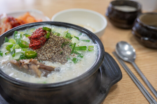 Hot boiling korean pork soup with perilla seed powder at a restaurant in dongmyo flea market in seoul south korea.
