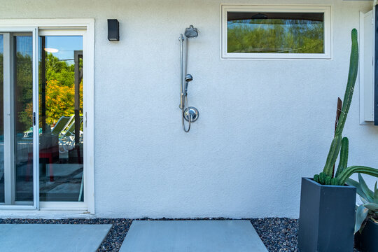 Outdoor shower on a home exterior wall