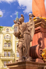 Obraz premium Baroque angel statue on Market Square fountain in Swidnica, Lower Silesia, Poland