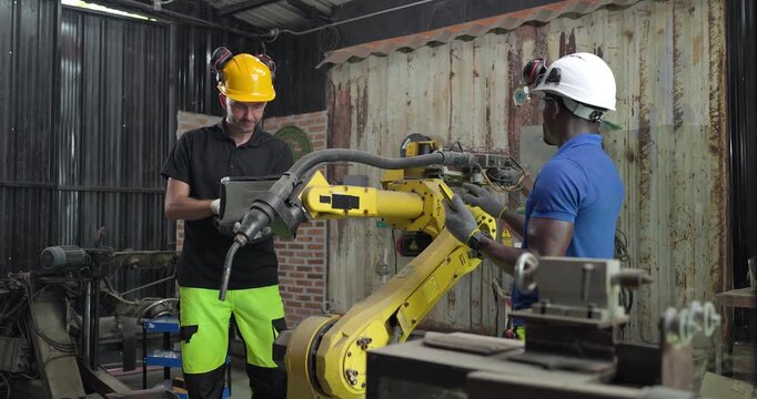 Technicians Troubleshoot Robotic Arm Control System for Automation Maintenance