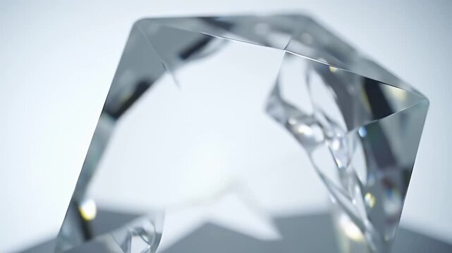 Clear geometric crystal prism reflecting light.