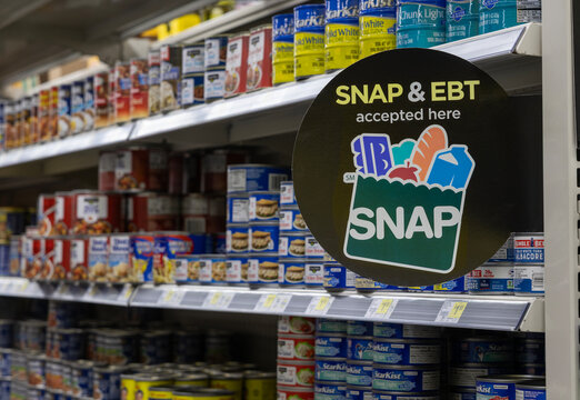 SNAP and EBT Accepted here sign. SNAP and Food Stamps provide benefits to help the budgets of disadvantaged families.
