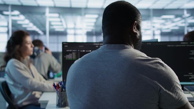 Admin operating in computer network security data center listening music from a secondary camera angle while connecting firewall checks, bottleneck diagnosis and data transfer performance.