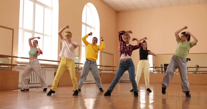 Group of dancers practicing dance moves in studio